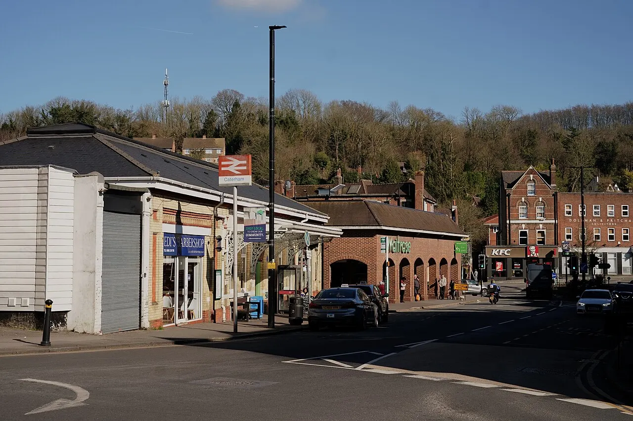 Caterham station frontage and adjacent town buildings in March 2025