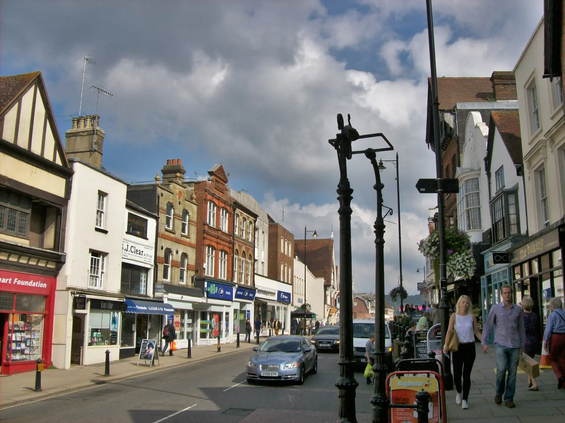 Shops and pedestrians on Dorking High Street in September 2014