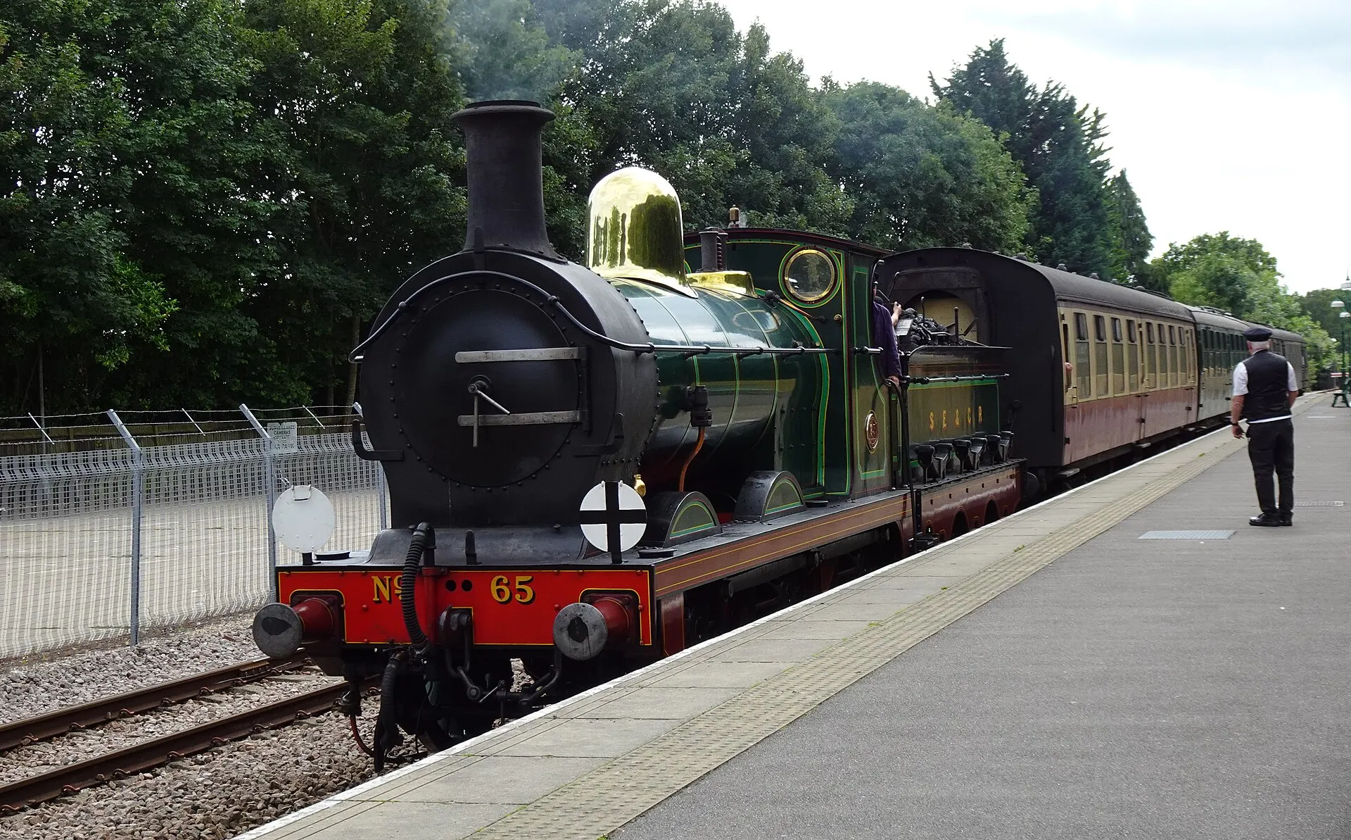 Steam train arriving at the Bluebell Railway’s East Grinstead station in July 2023