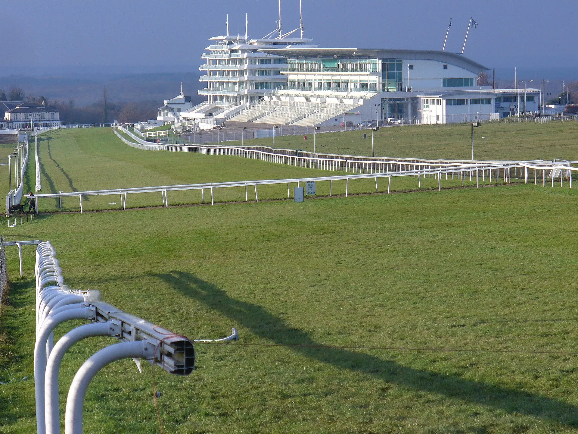 Racegoers beside the Epsom Downs grandstand
