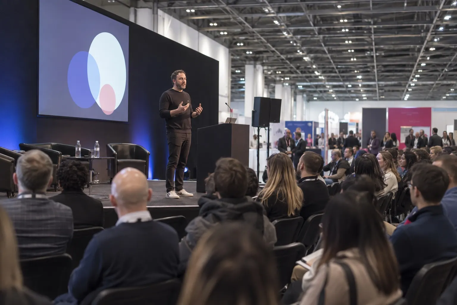 Illustrative entrepreneur keynote in an Excel-like business exhibition theatre