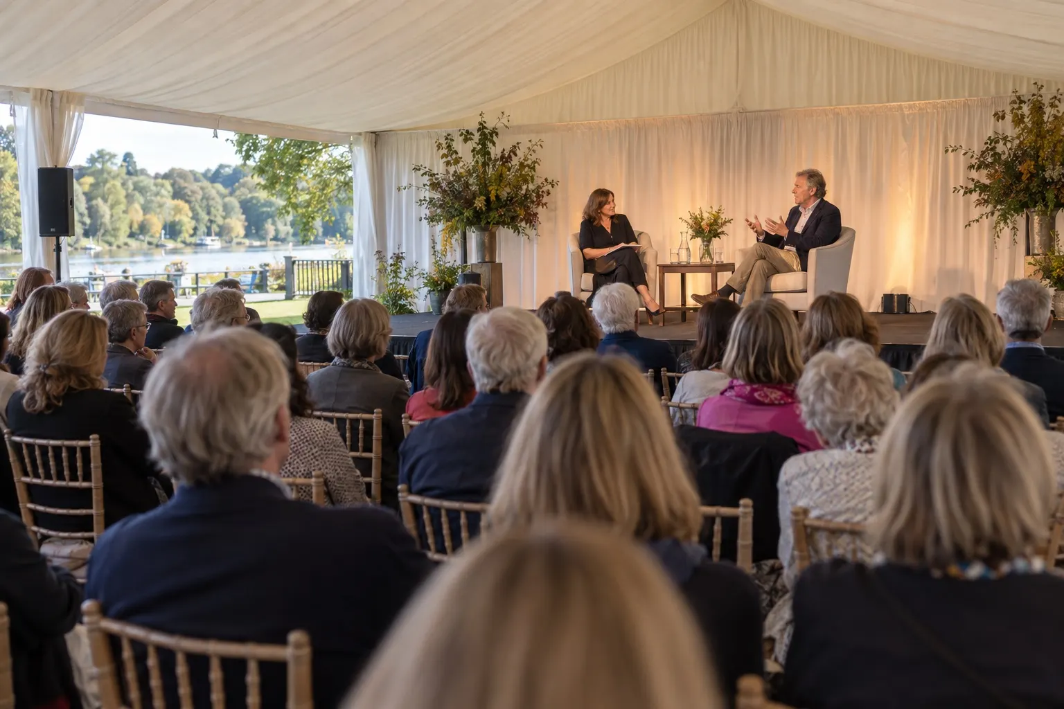 Illustrative author conversation in a Henley riverside festival marquee