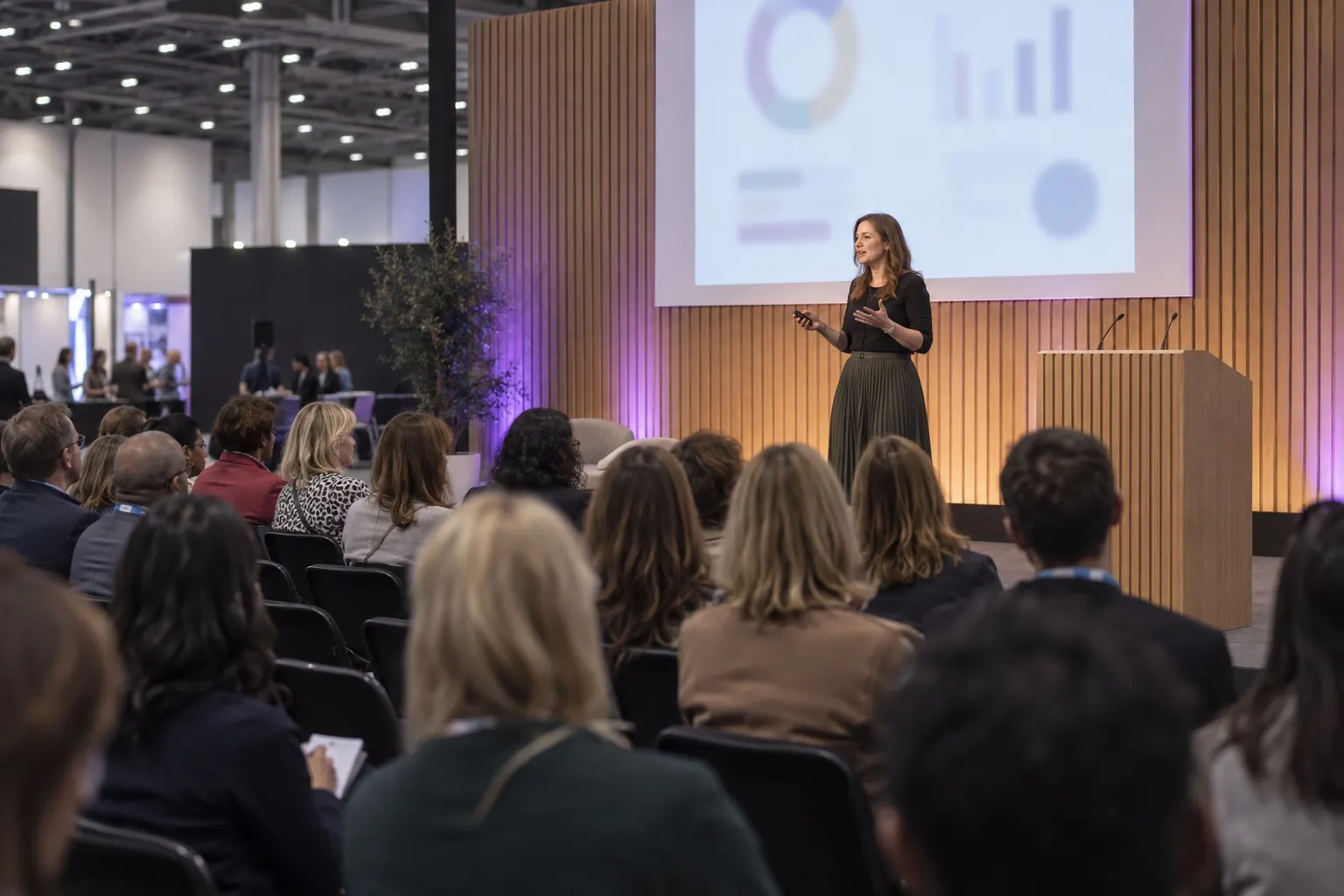 Illustrative HR technology keynote with speaker and seated audience