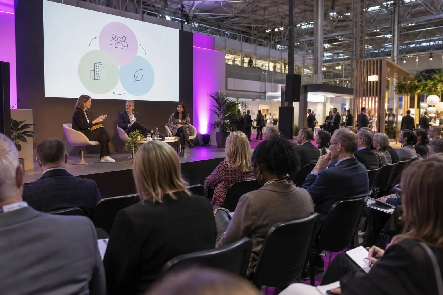 Illustrative workplace leadership discussion in an NEC Knowledge Hub-style theatre