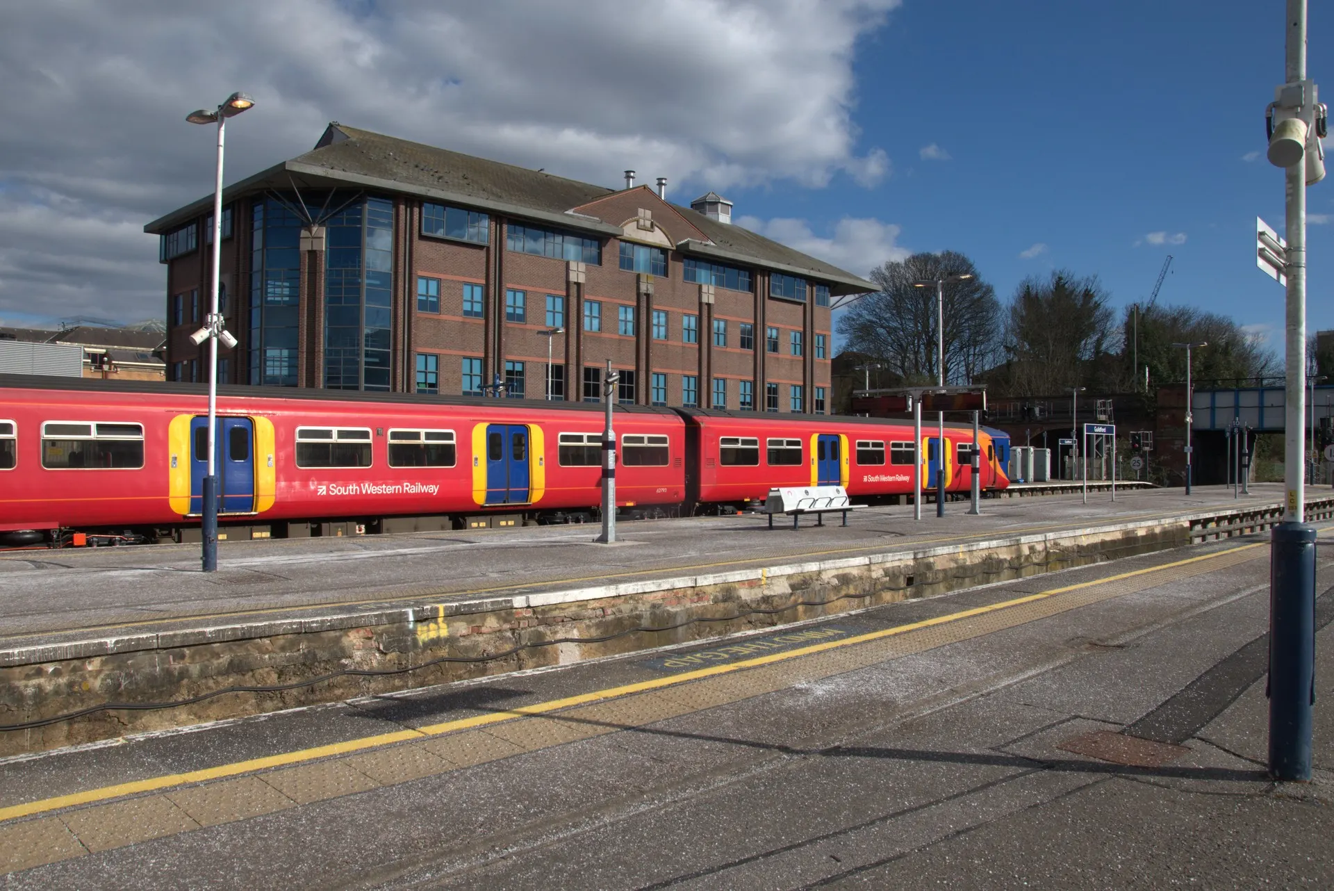 A train beside the station building at Guildford