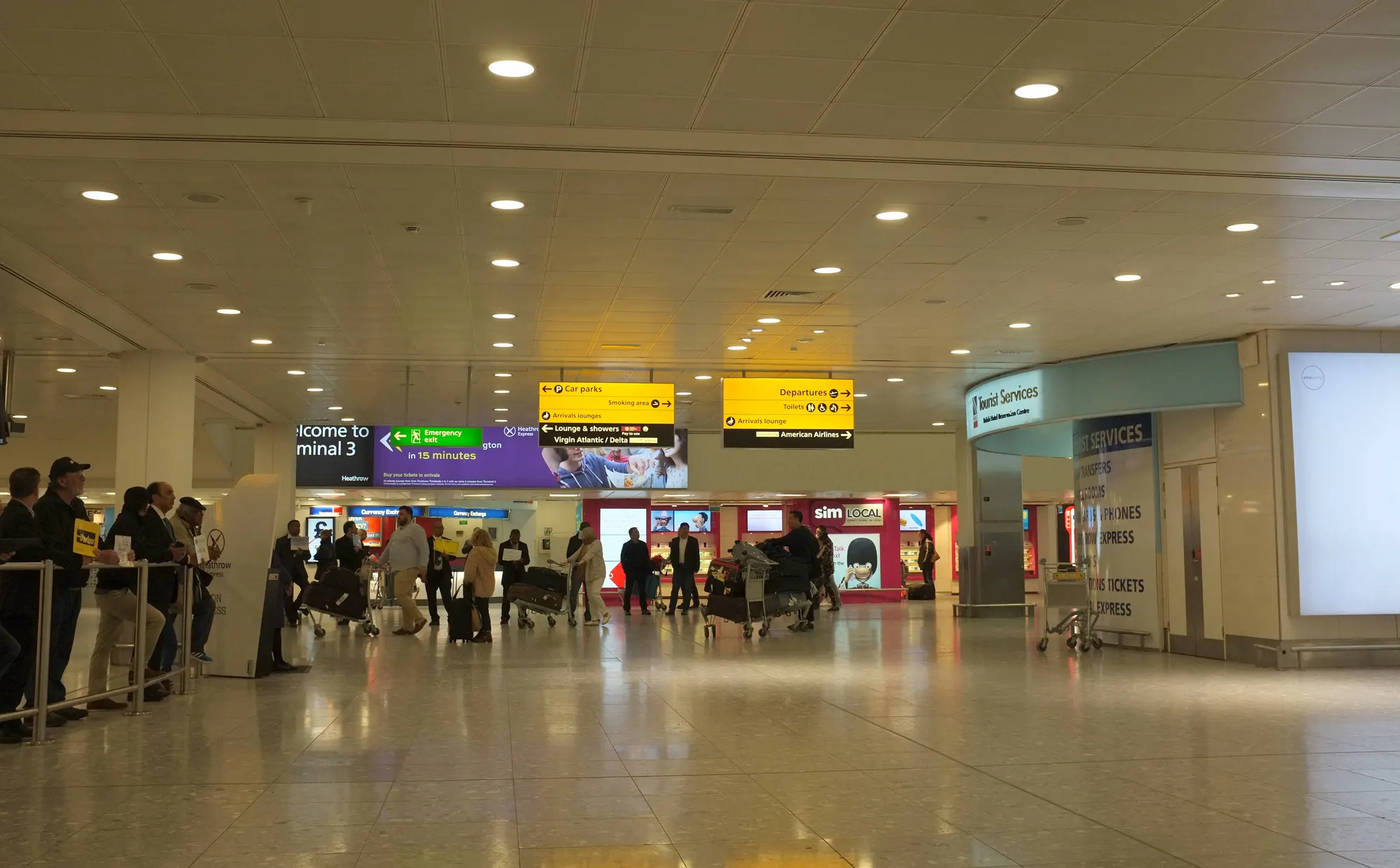 Heathrow Terminal 3 public arrivals hall photographed in May 2018; historic scene is not current meeting-point signage