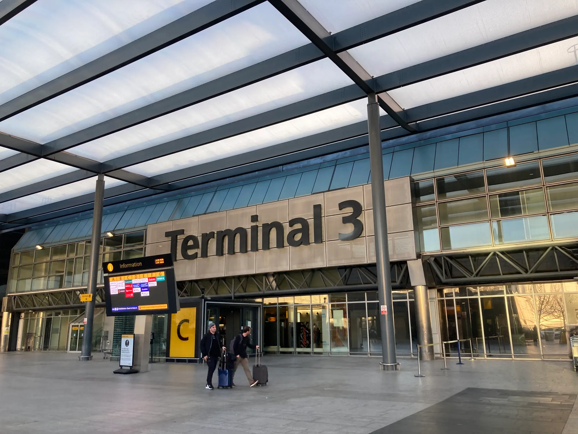 Heathrow Terminal 3 Entrance C and public frontage photographed in October 2022; use current entrance and parking signs