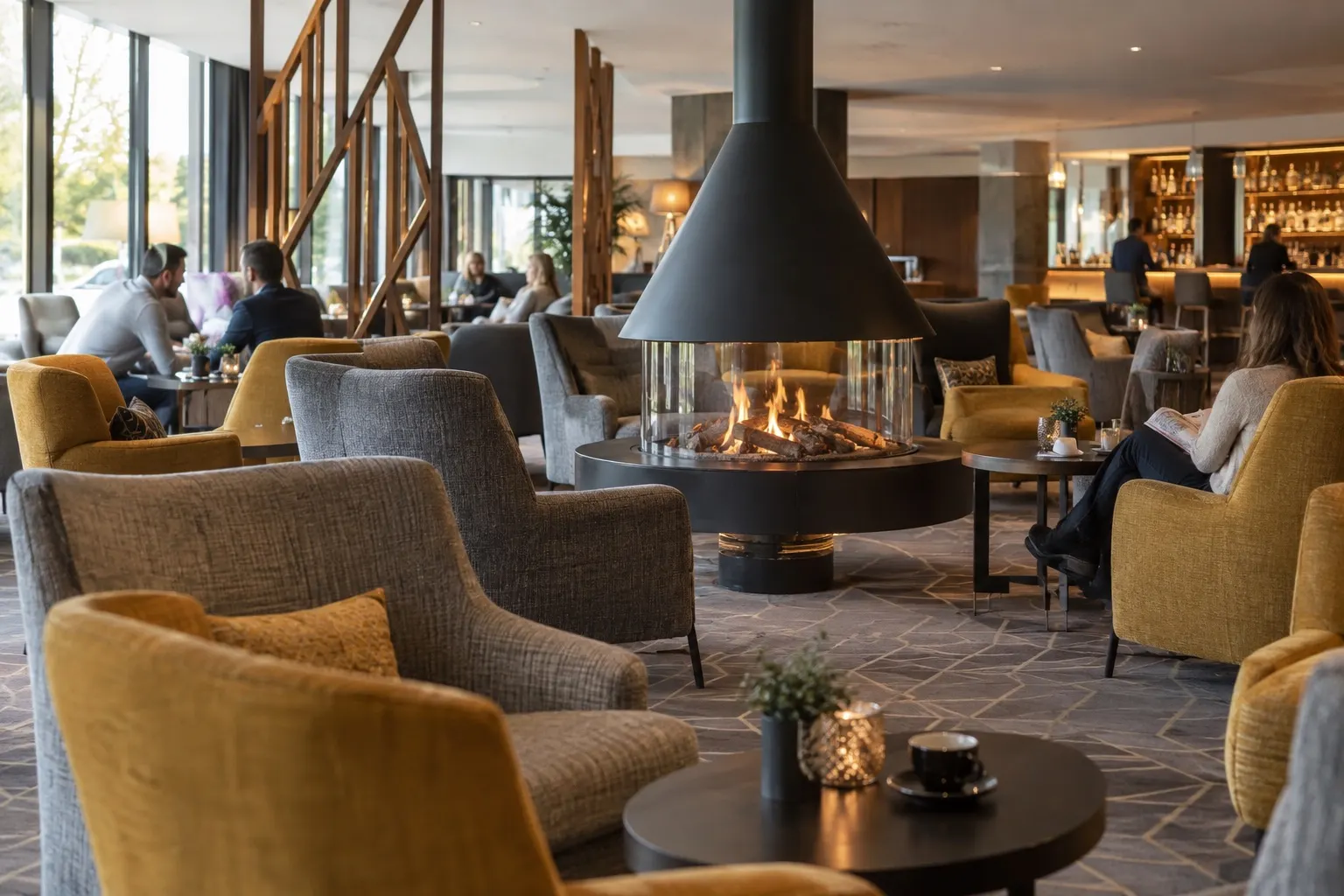 Illustrative Aspen Lounge scene with a circular fireplace and upholstered seating