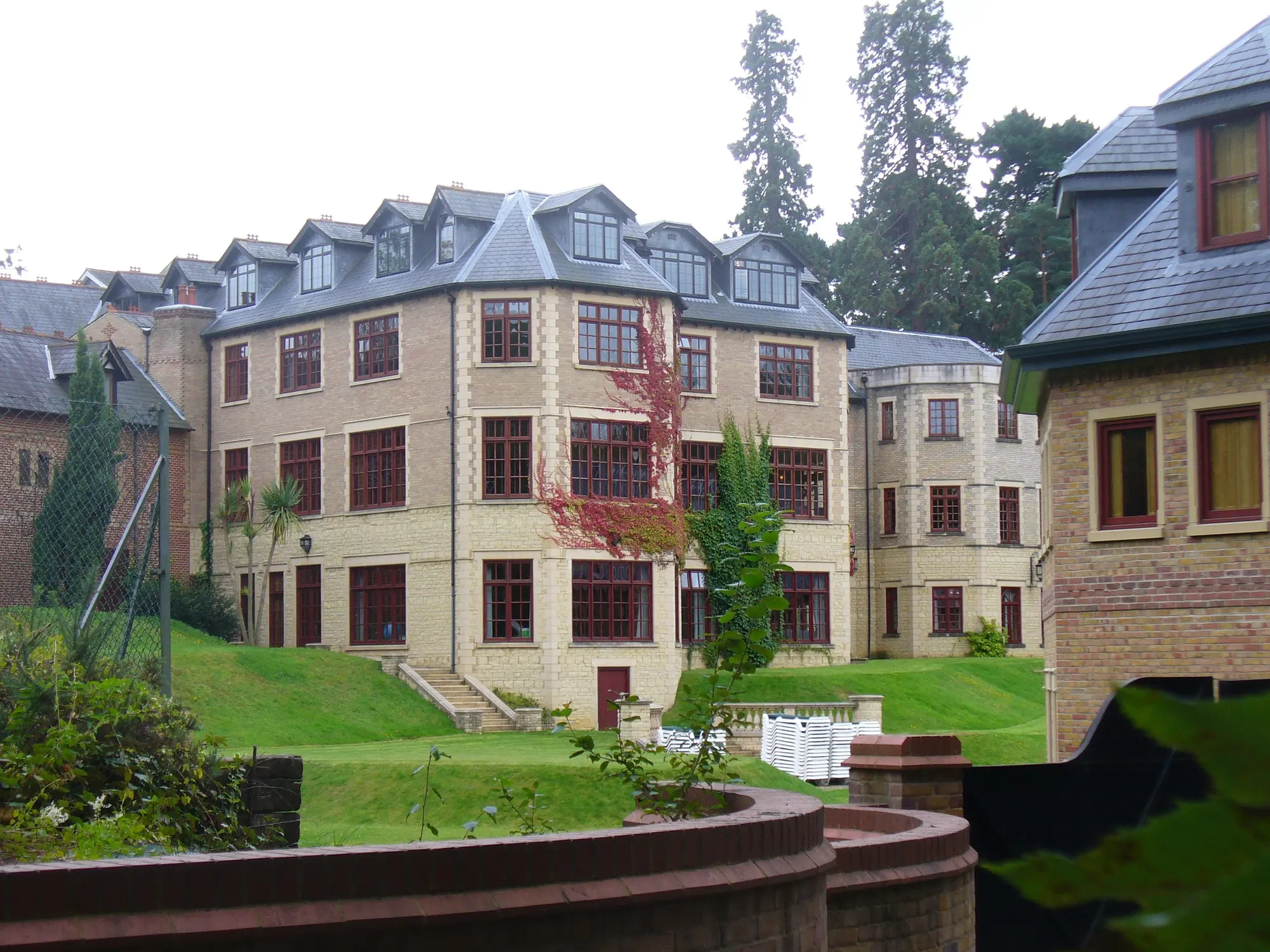 Pennyhill Park's pale-stone hotel building and garden lawn photographed in 2011