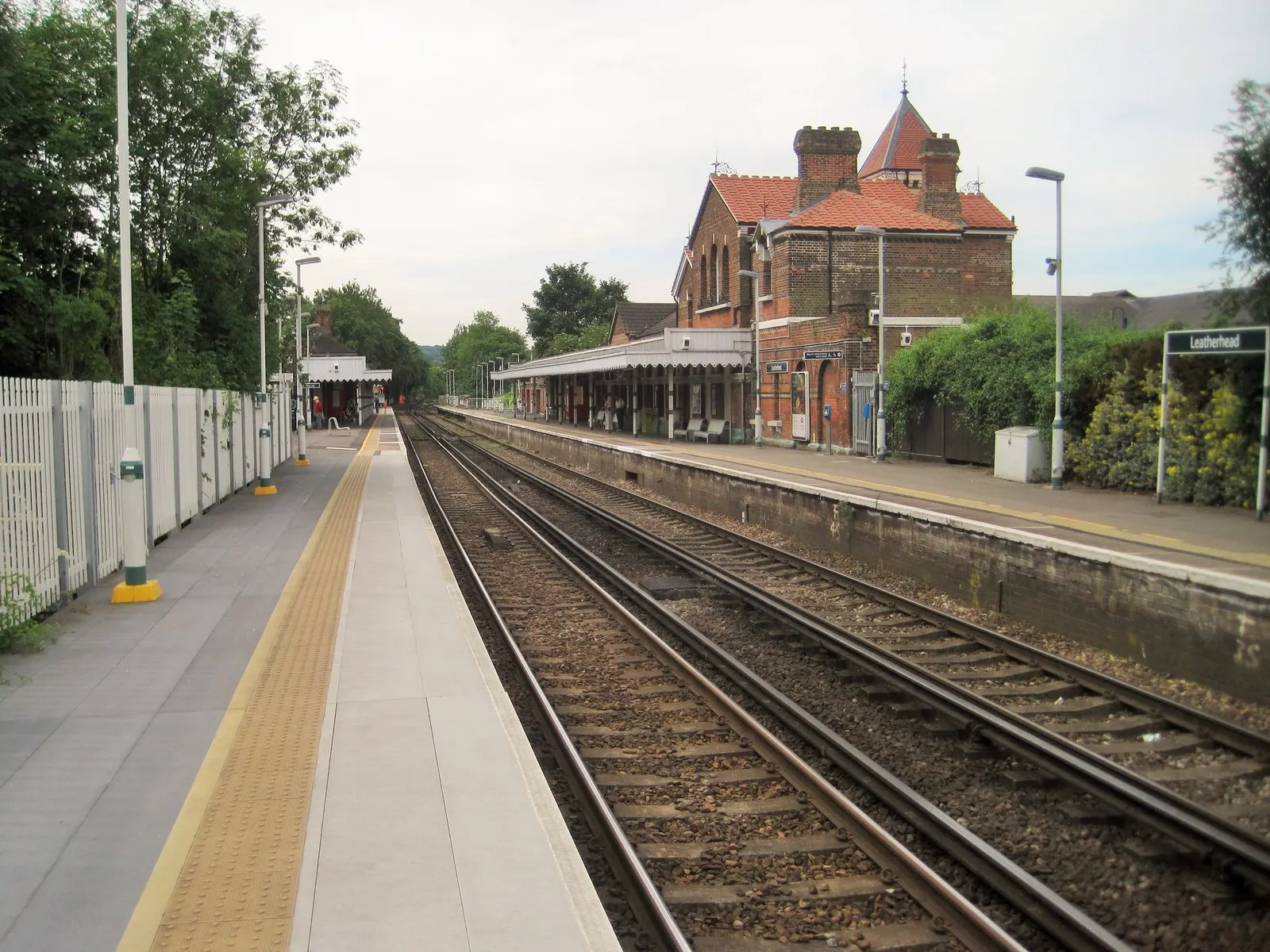 Platforms and station building at Leatherhead railway station in June 2015