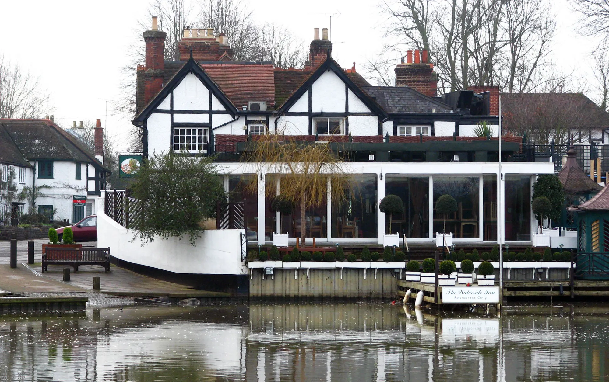 The Waterside Inn riverside building photographed across the Thames in winter