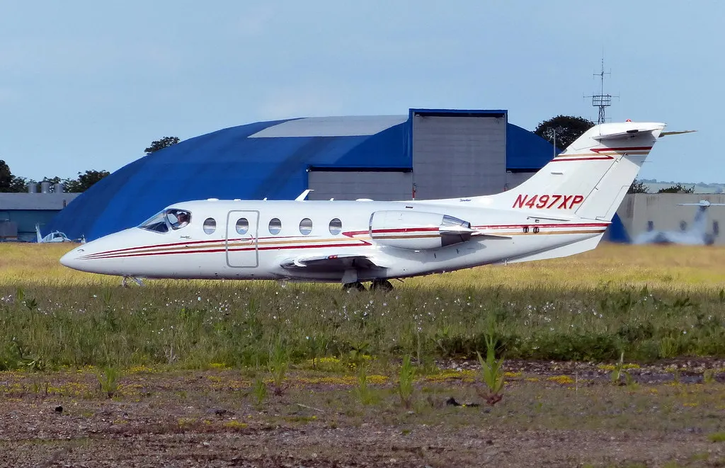 Private jet at London Oxford Airport in Kidlington photographed in June 2015; historic aircraft and apron context