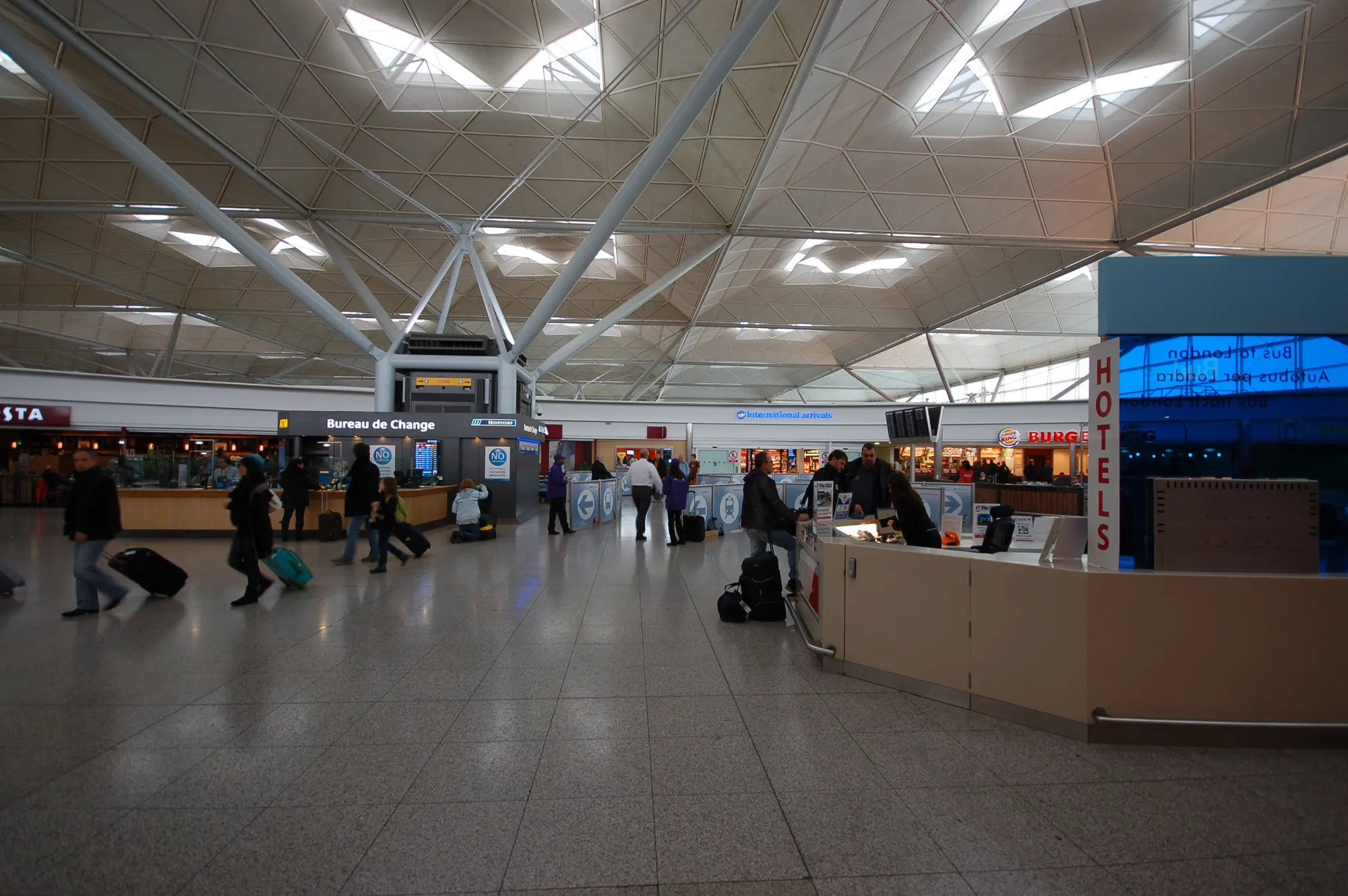 Historic London Stansted Airport public arrivals hall photographed in October 2010; shops and meeting positions may have changed