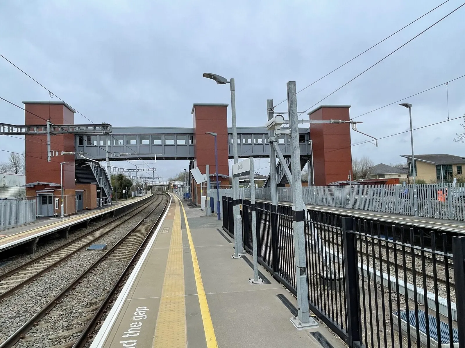 Platforms and footbridge at Theale railway station in February 2024