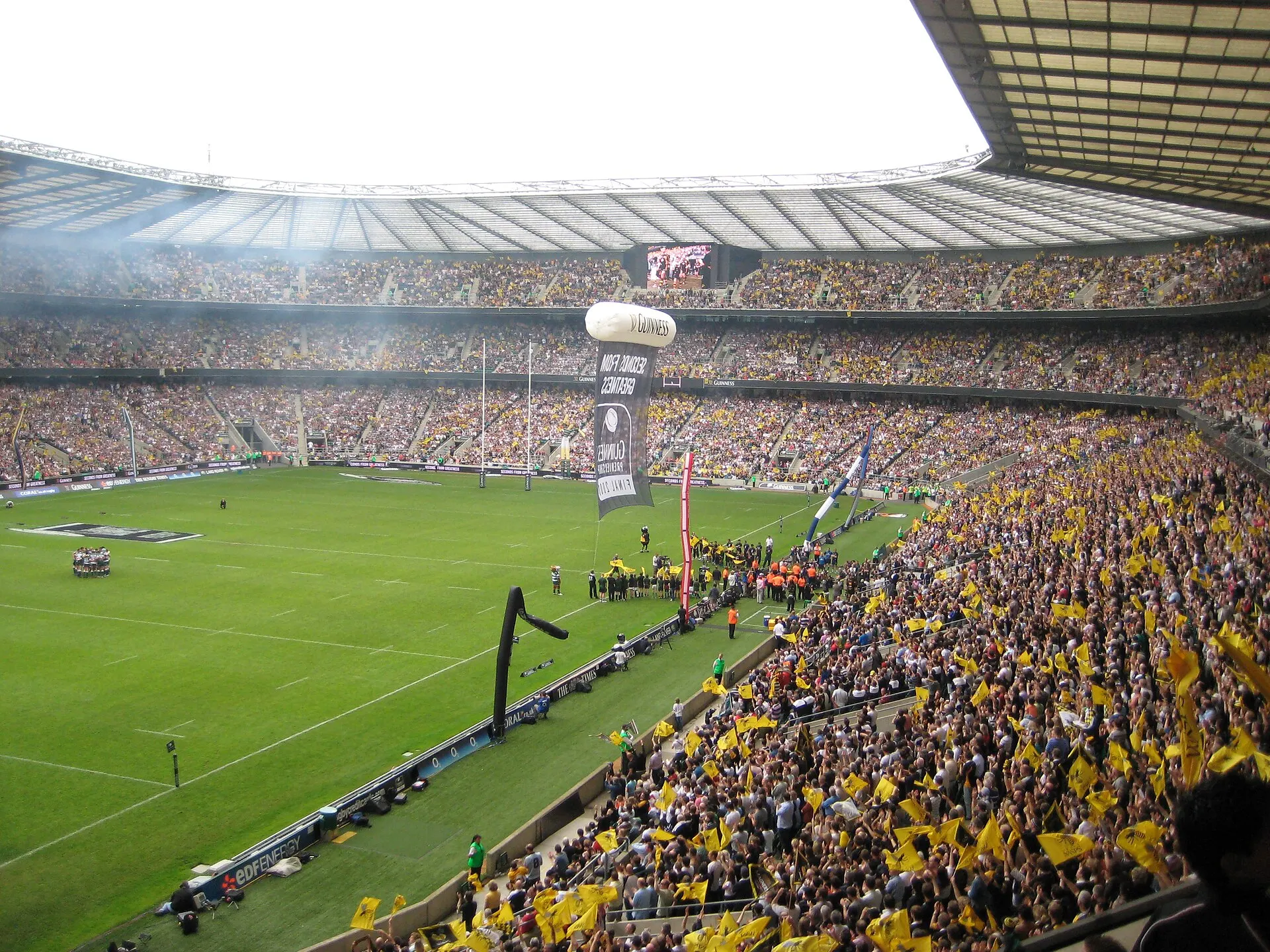 Supporters and rugby action inside Twickenham Stadium