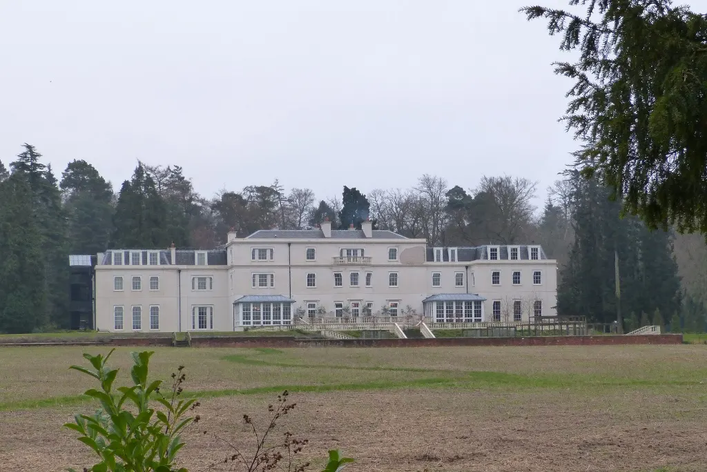 Coworth Park's real country house across its meadow, photographed in 2014